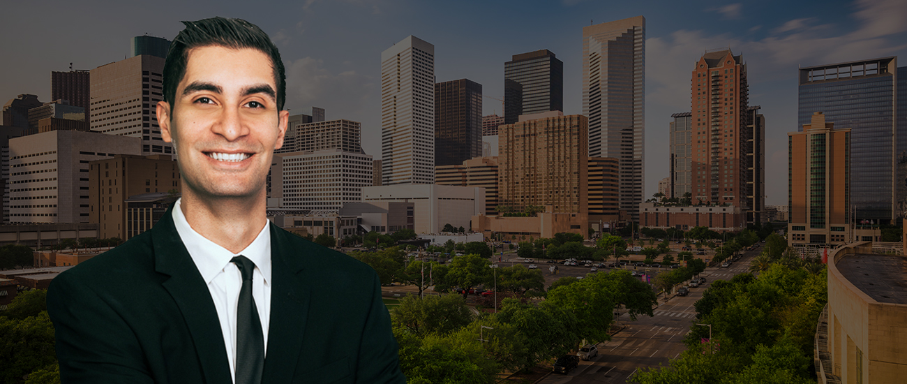 Armand Jawanmardi with a photograph of the Houston skyline with a dark filter.